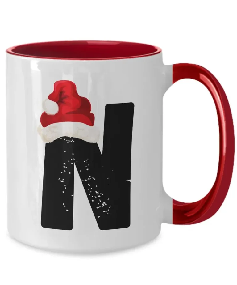Monogram Letter “N” Christmas Coffee Mug with Christmas Hat On by Coni Blau